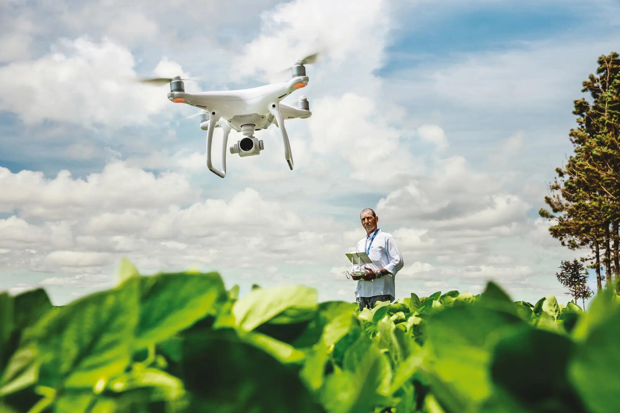 Farmer operating a quadrocopter
