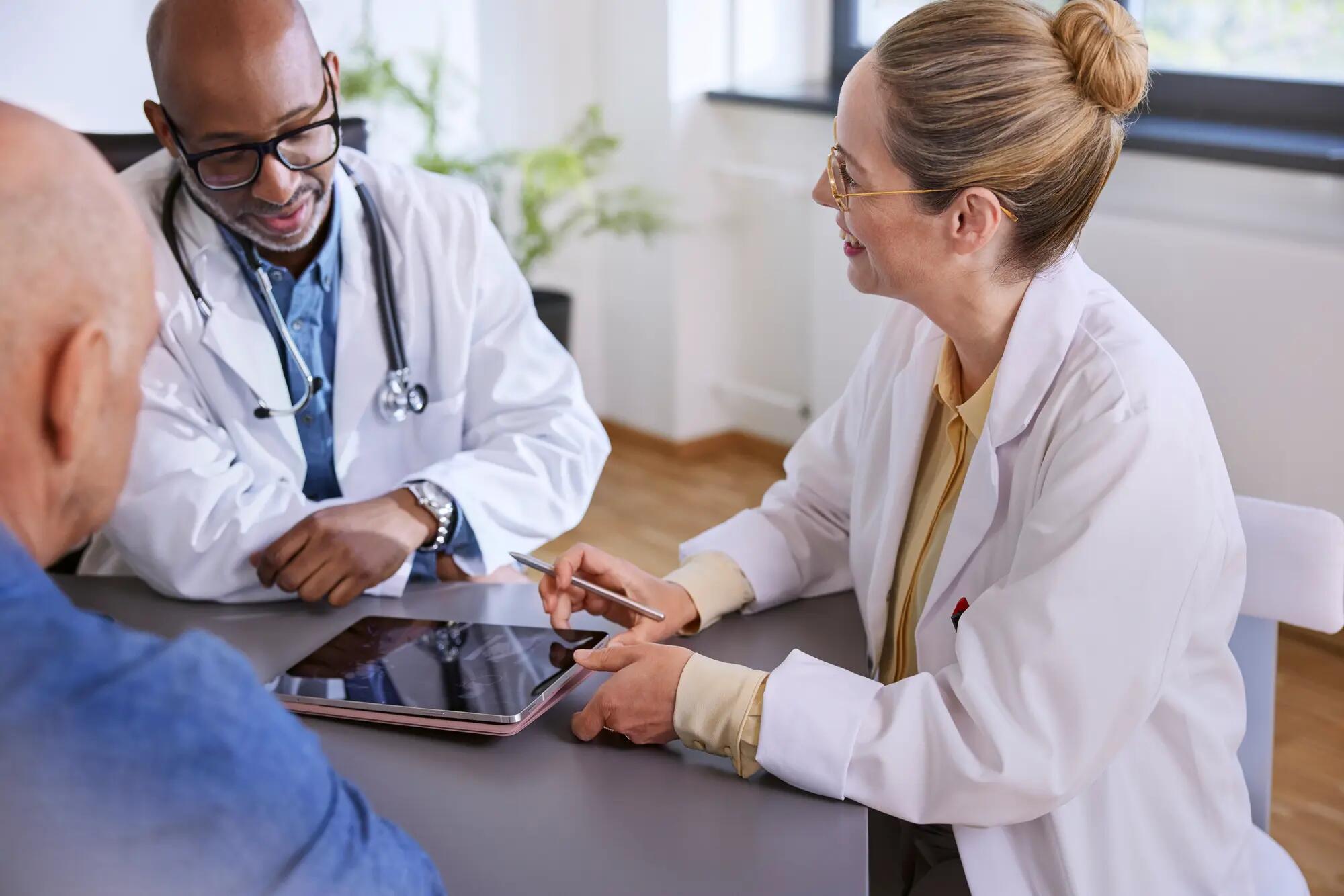 Patient and radiology team discussing scans.