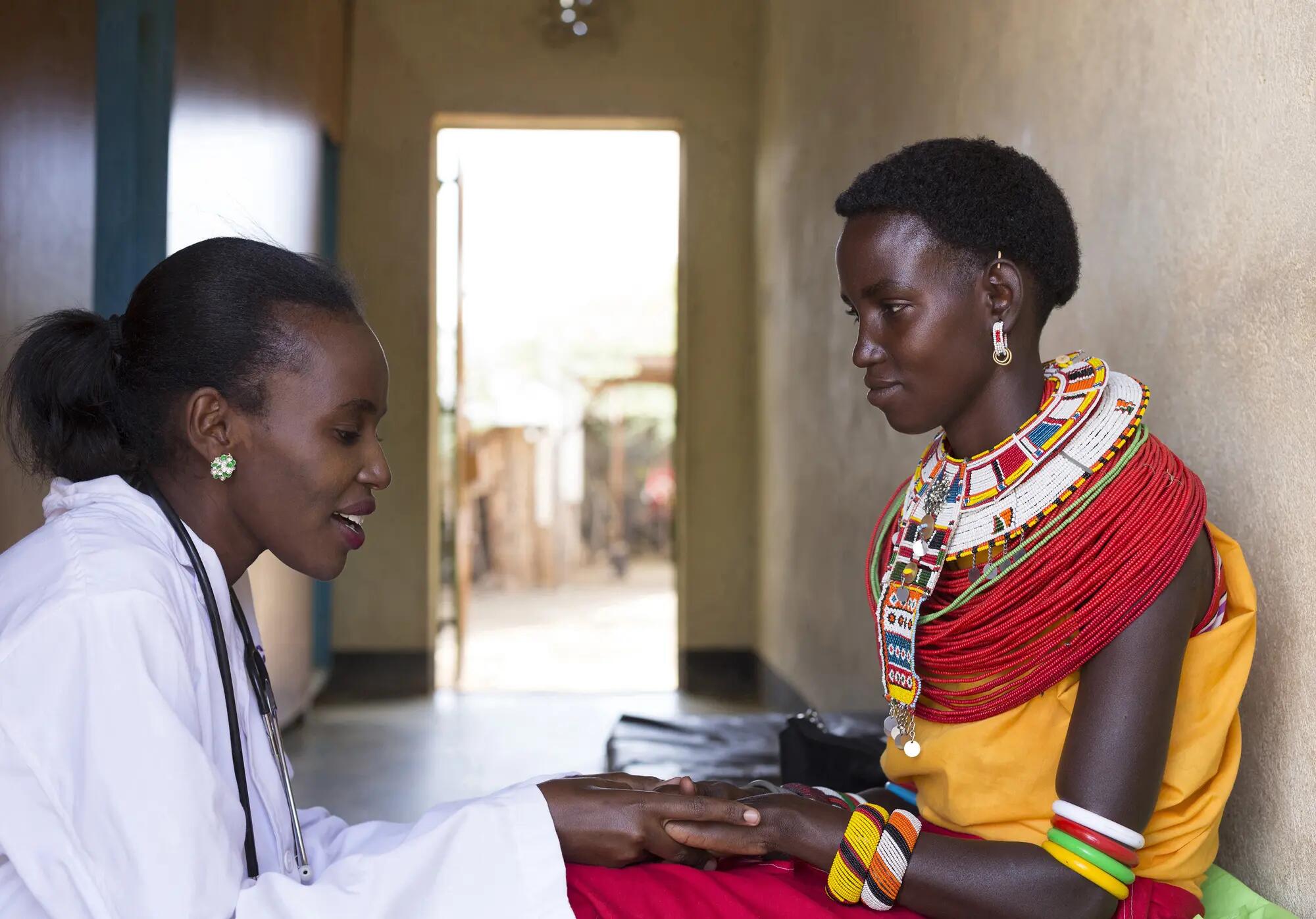 African doctor with patient