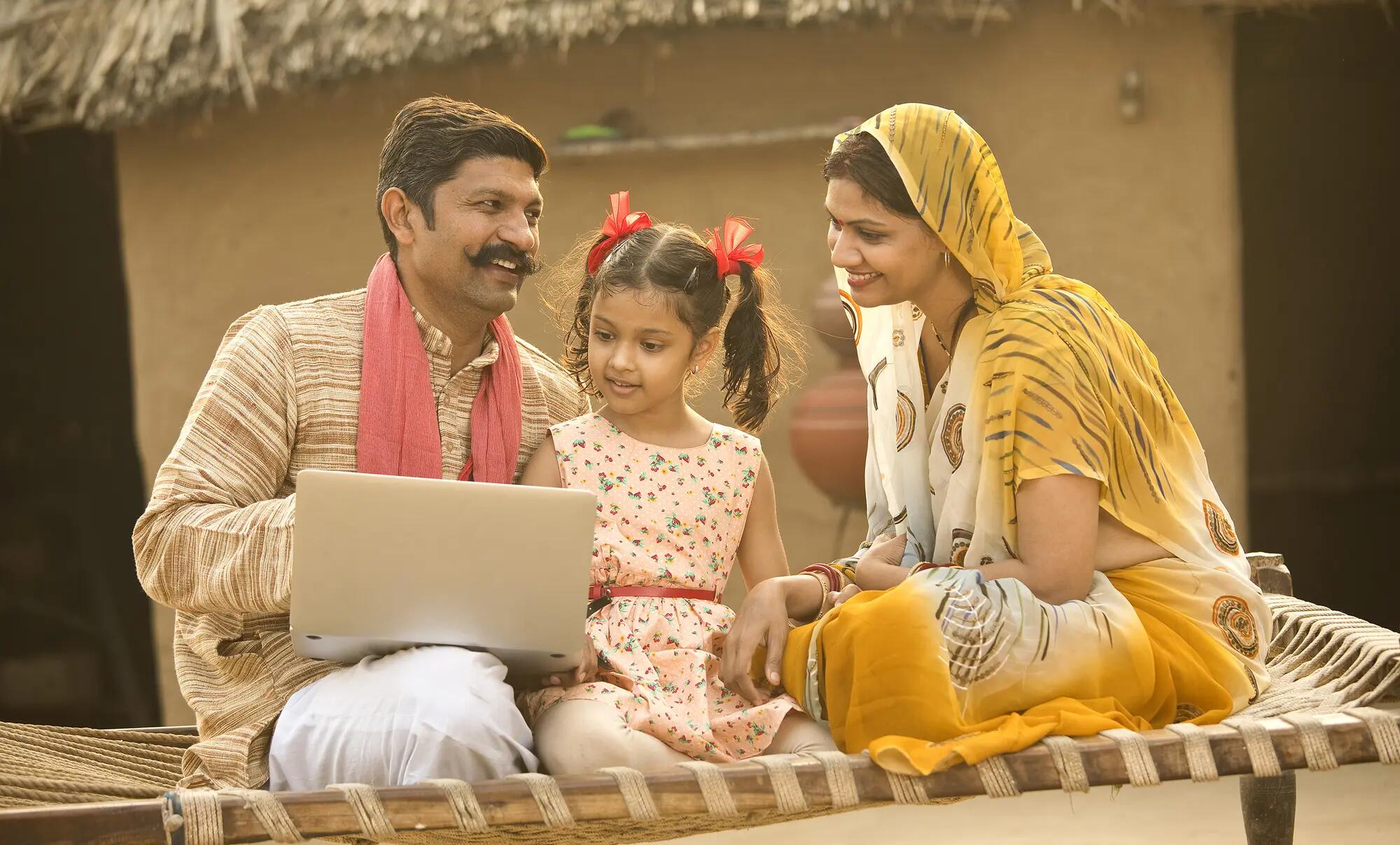 Happy indian parents_with daughter