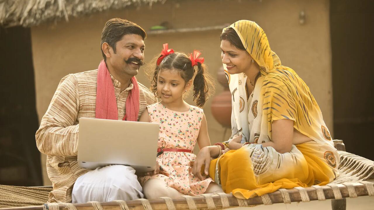 Happy indian parents_with daughter