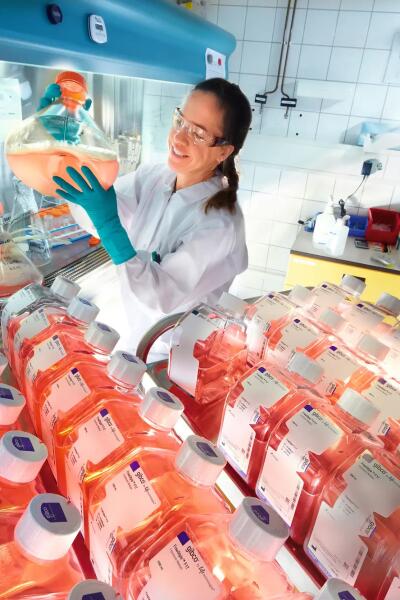 Researcher with cell culture media