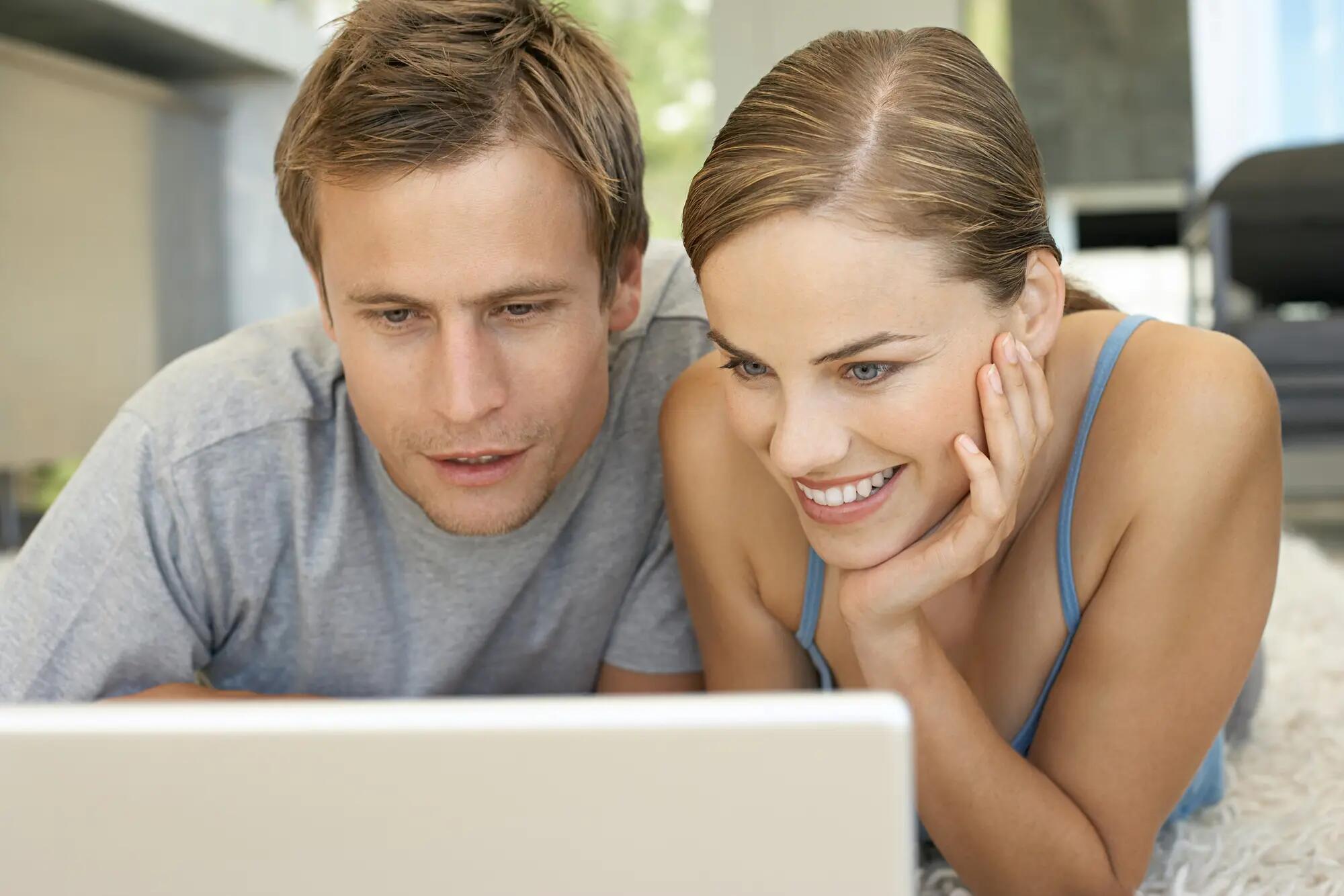 Young couple using laptop